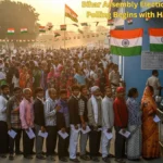 Bihar Assembly Elections 2025: Phase 1 Polling Begins with High Enthusiasm Voters queue outside a polling booth during the first phase of Bihar Assembly Elections 2025, with security personnel and EVM machines visible.